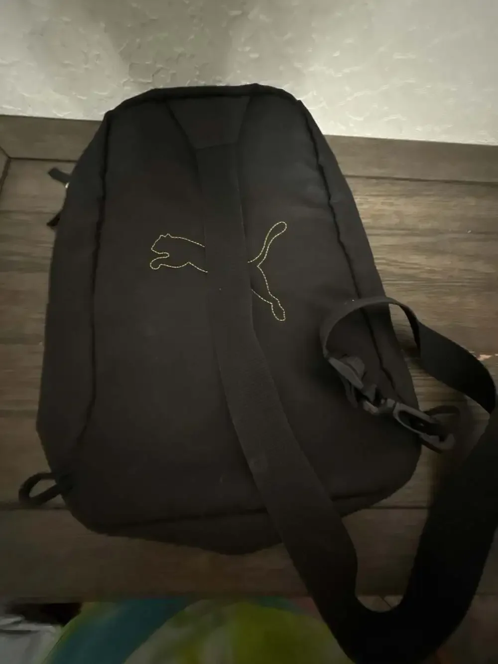 Puma Black Sling Backpack with Gold Logo